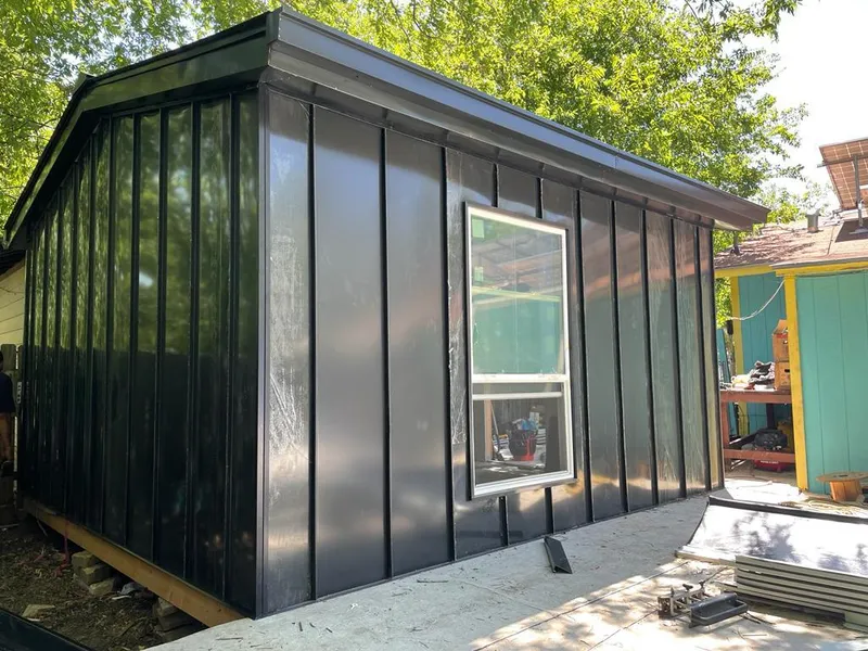 Black standing seam metal wall panels for Roof Inspection in Davenport