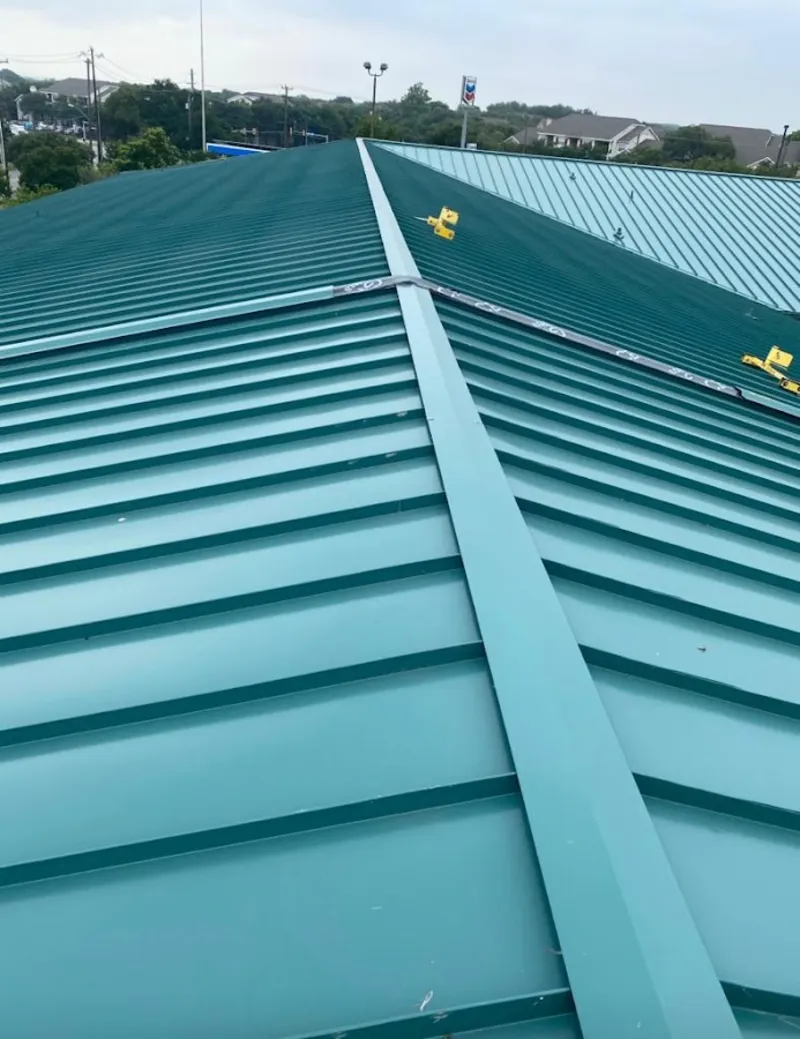Green commercial metal roof ridge and valley for Metal Roof Repair in Davenport