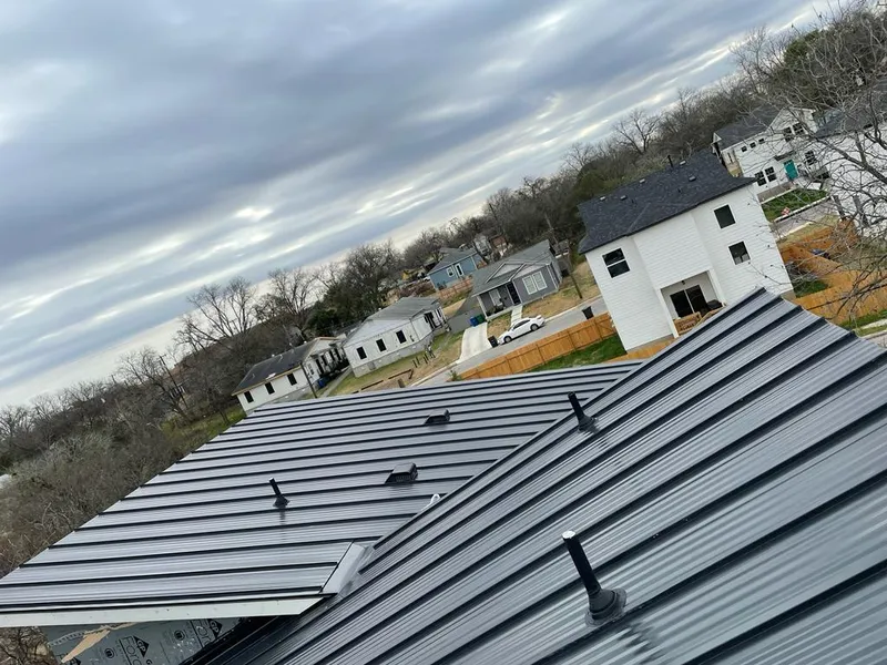 Standing seam metal roof panels with vents for Skylight Repair in Davenport